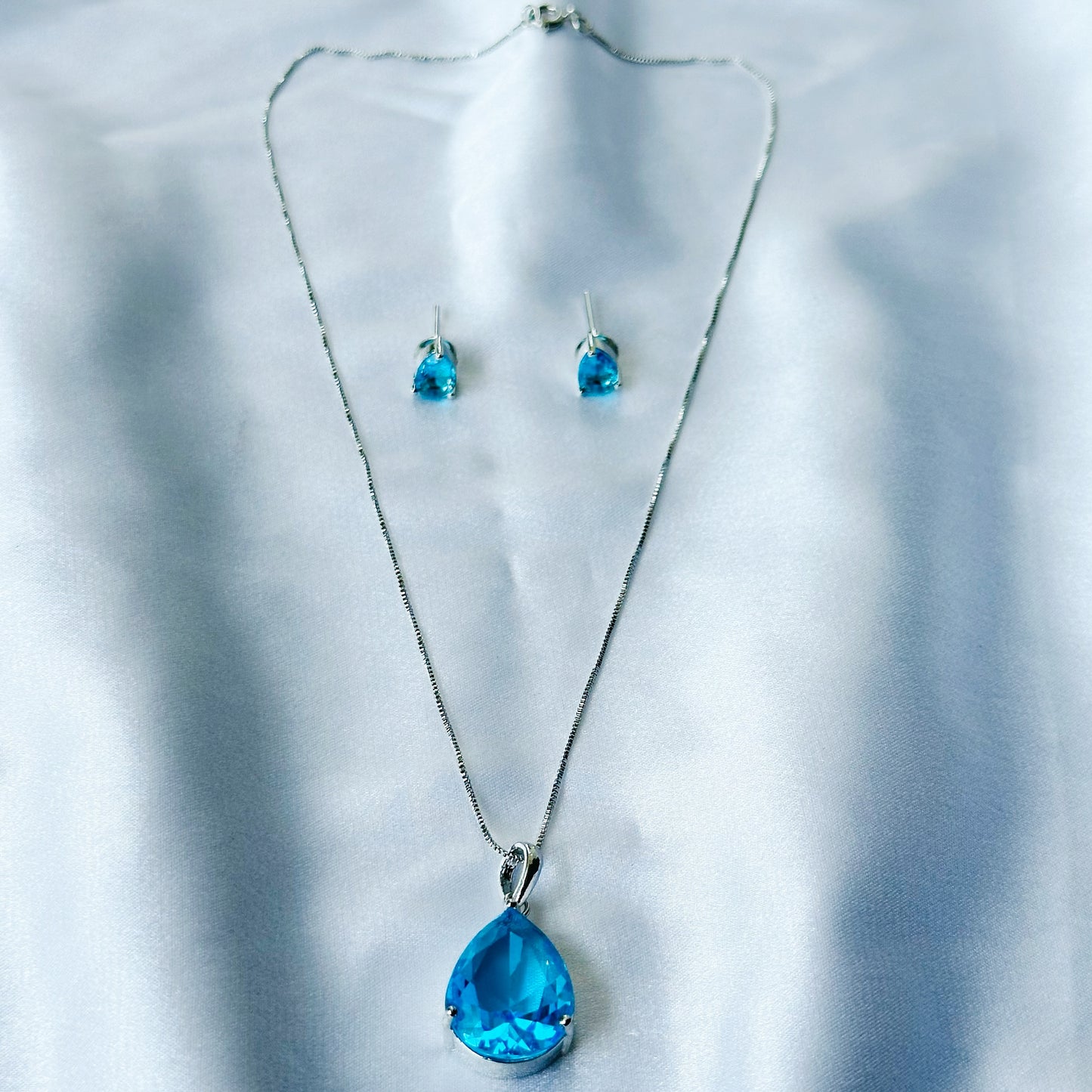 Aqua Blue Sapphire Cubic Zircon American Diamond Silver Plated Pendant Set