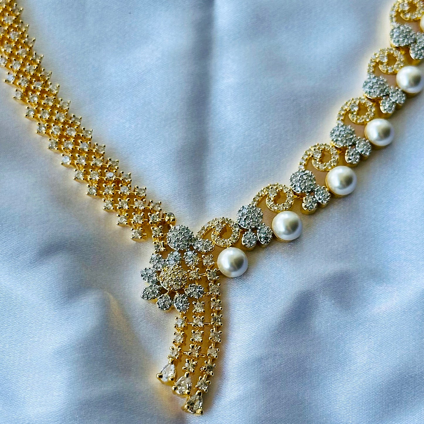 Solitaire Cubic Zircon American Diamond Pearl Studded Gold Plated Necklace Set