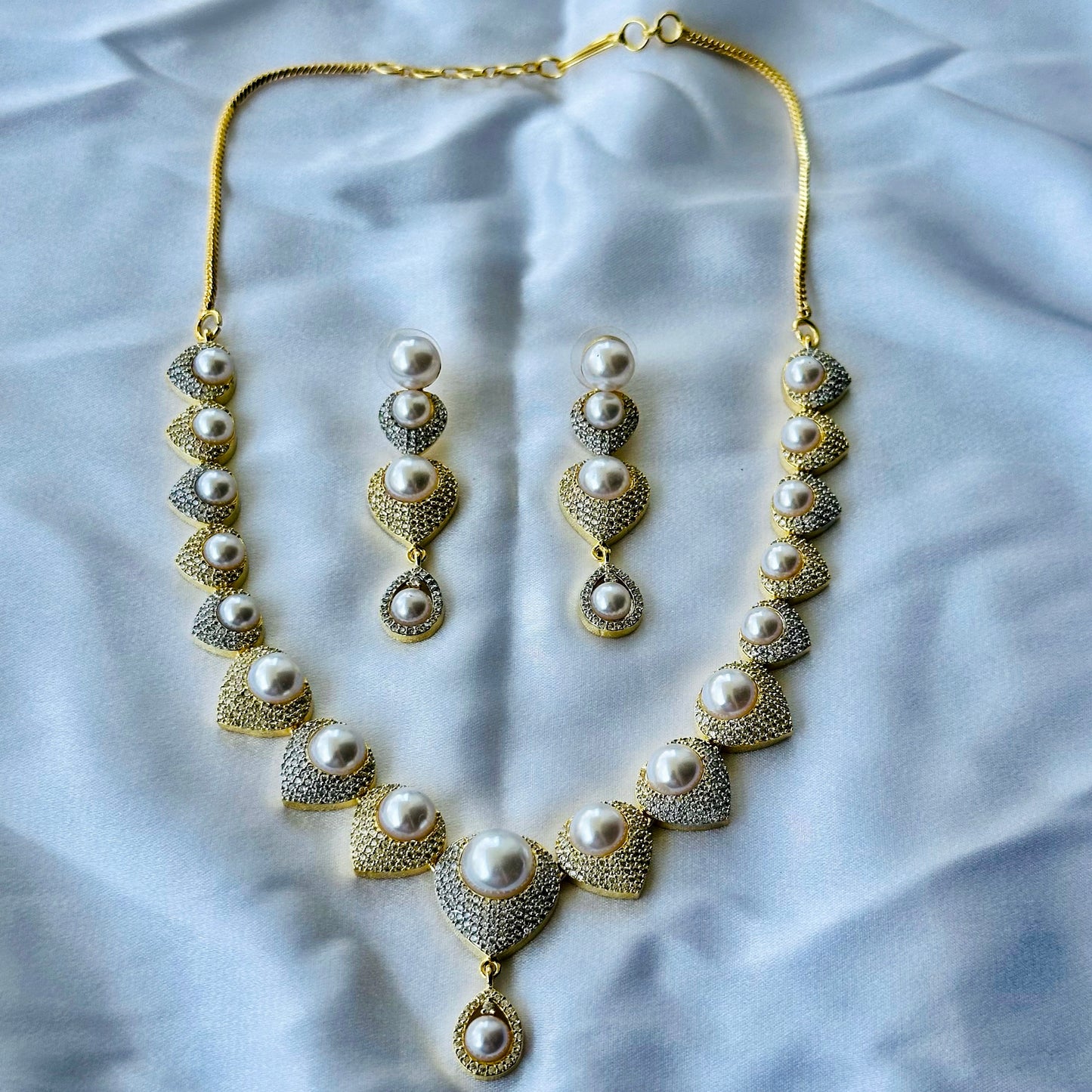 Solitaire Cubic Zircon American Diamond Pearl Studded Gold Plated Necklace Set