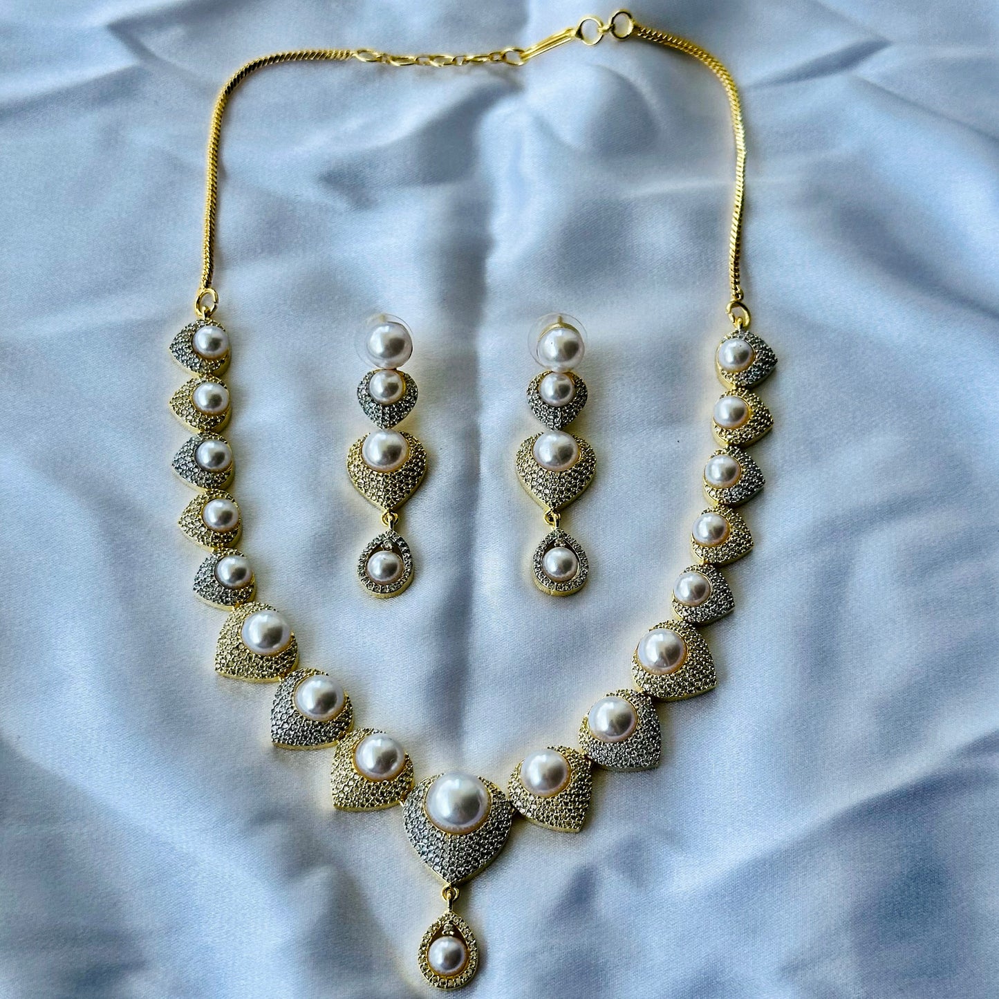 Solitaire Cubic Zircon American Diamond Pearl Studded Gold Plated Necklace Set