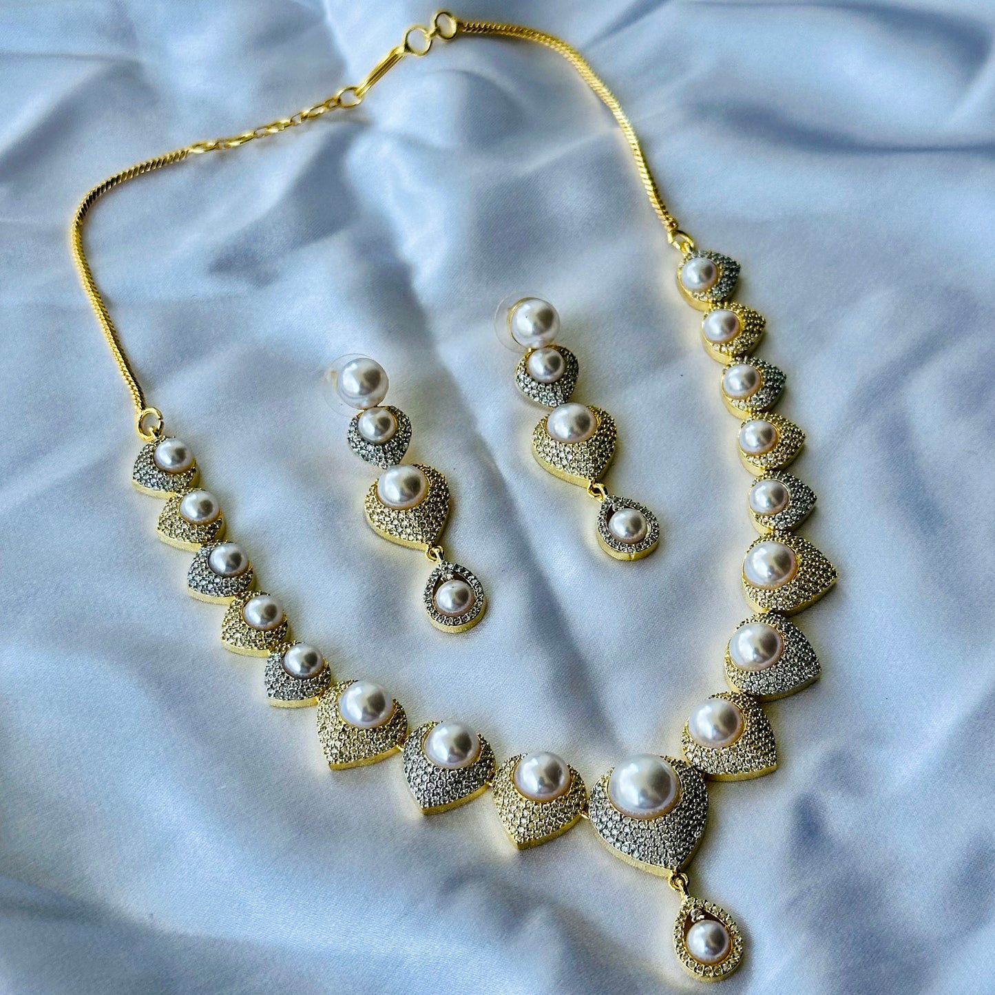 Solitaire Cubic Zircon American Diamond Pearl Studded Gold Plated Necklace Set