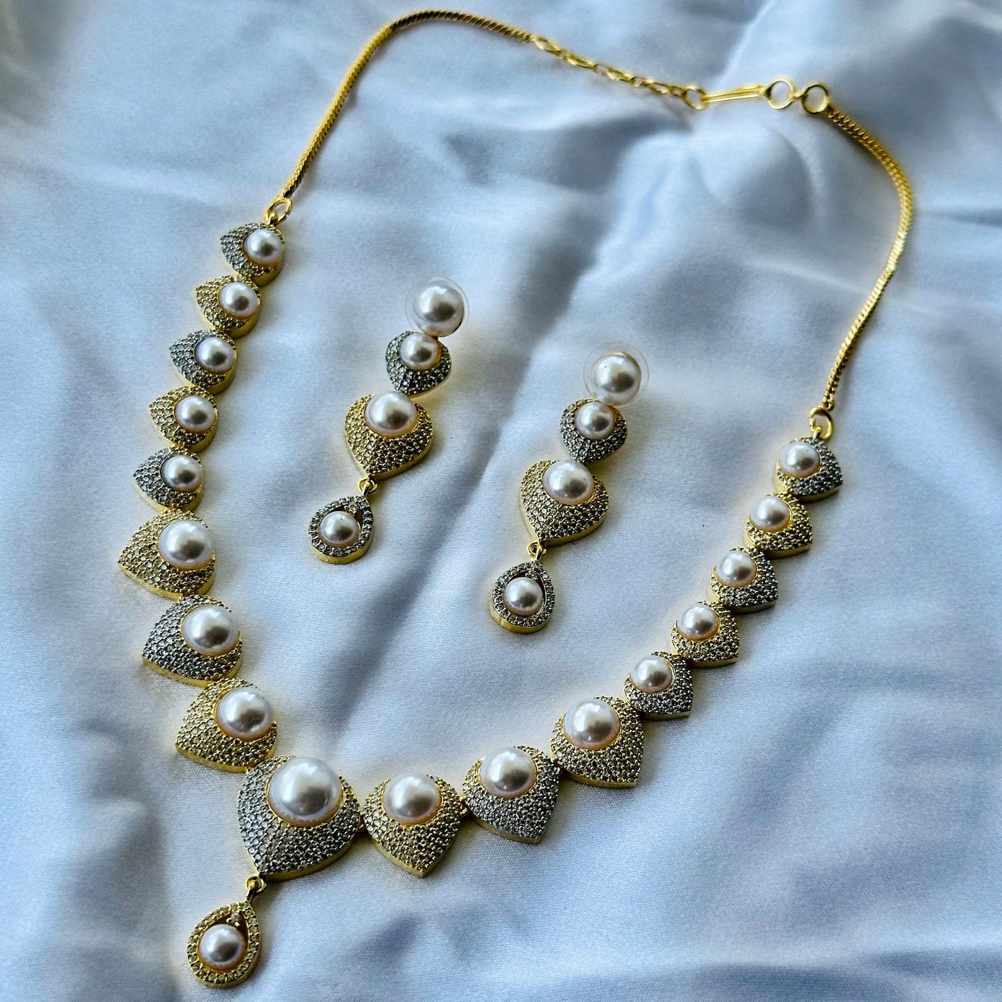 Solitaire Cubic Zircon American Diamond Pearl Studded Gold Plated Necklace Set