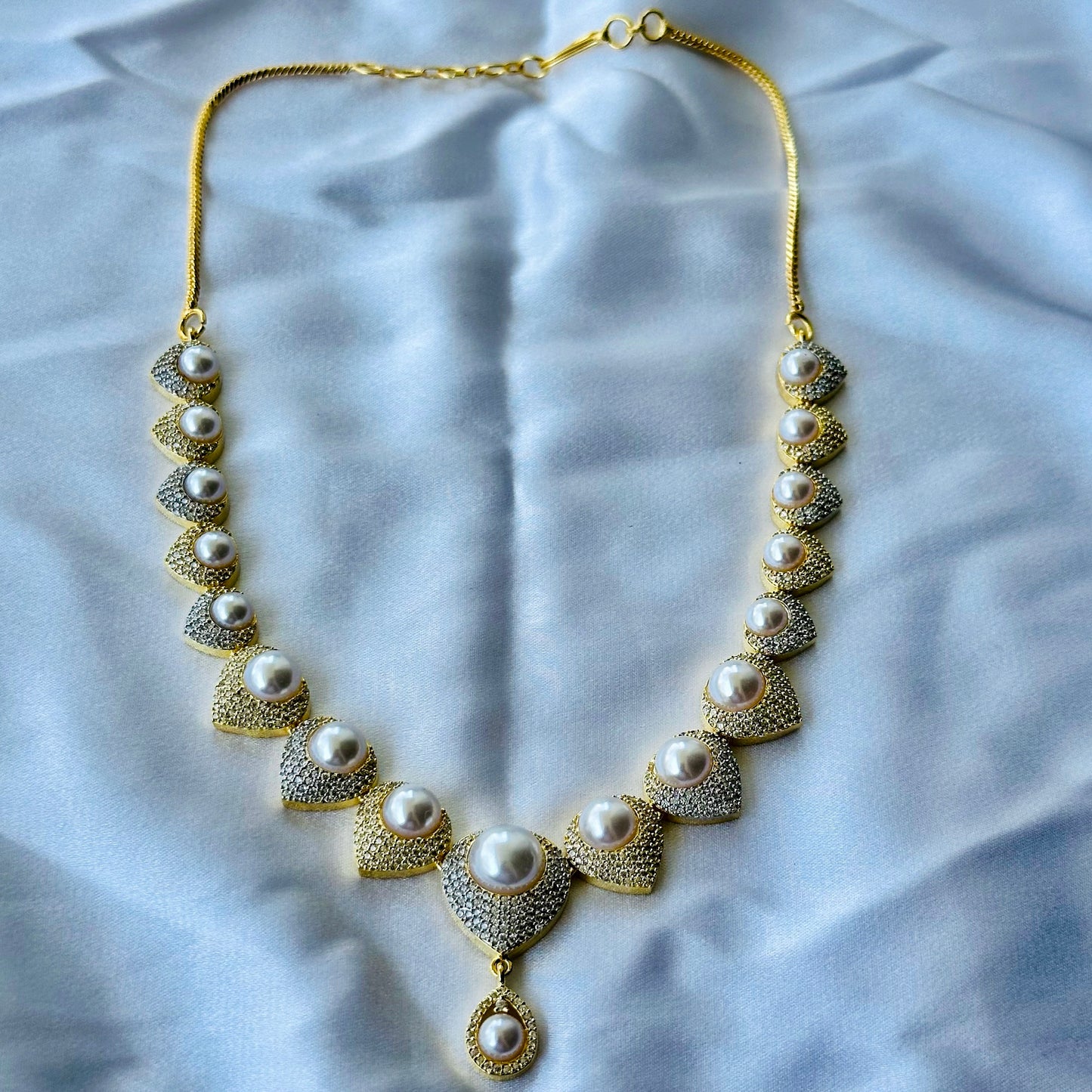 Solitaire Cubic Zircon American Diamond Pearl Studded Gold Plated Necklace Set