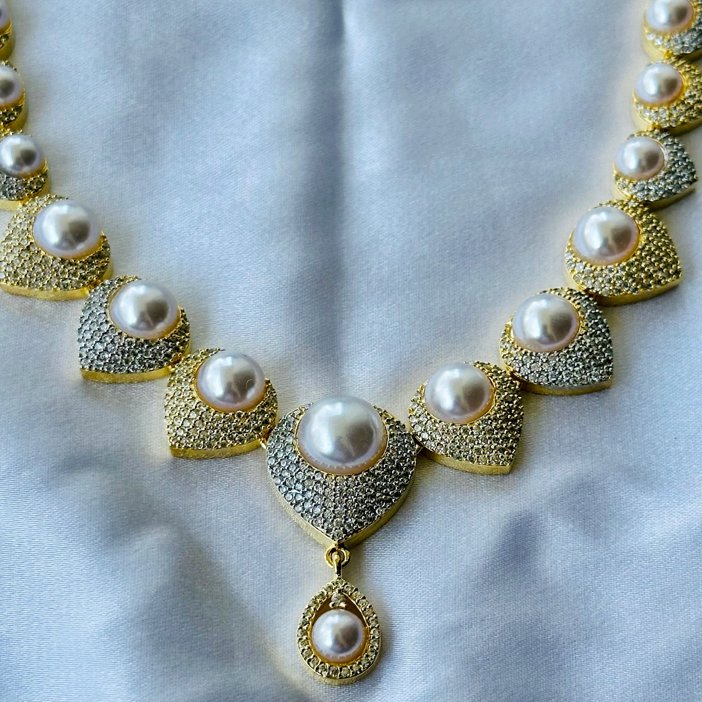 Solitaire Cubic Zircon American Diamond Pearl Studded Gold Plated Necklace Set