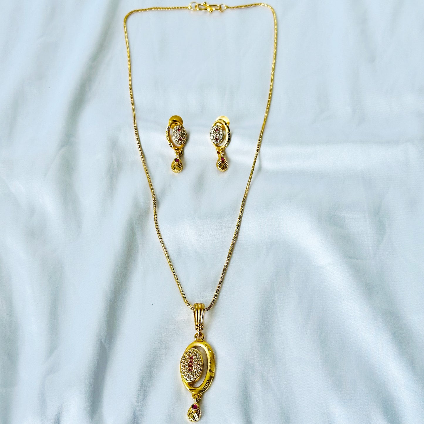 Oval Abstract Design American Diamond 1 Micron Gold Plated Pendant Set