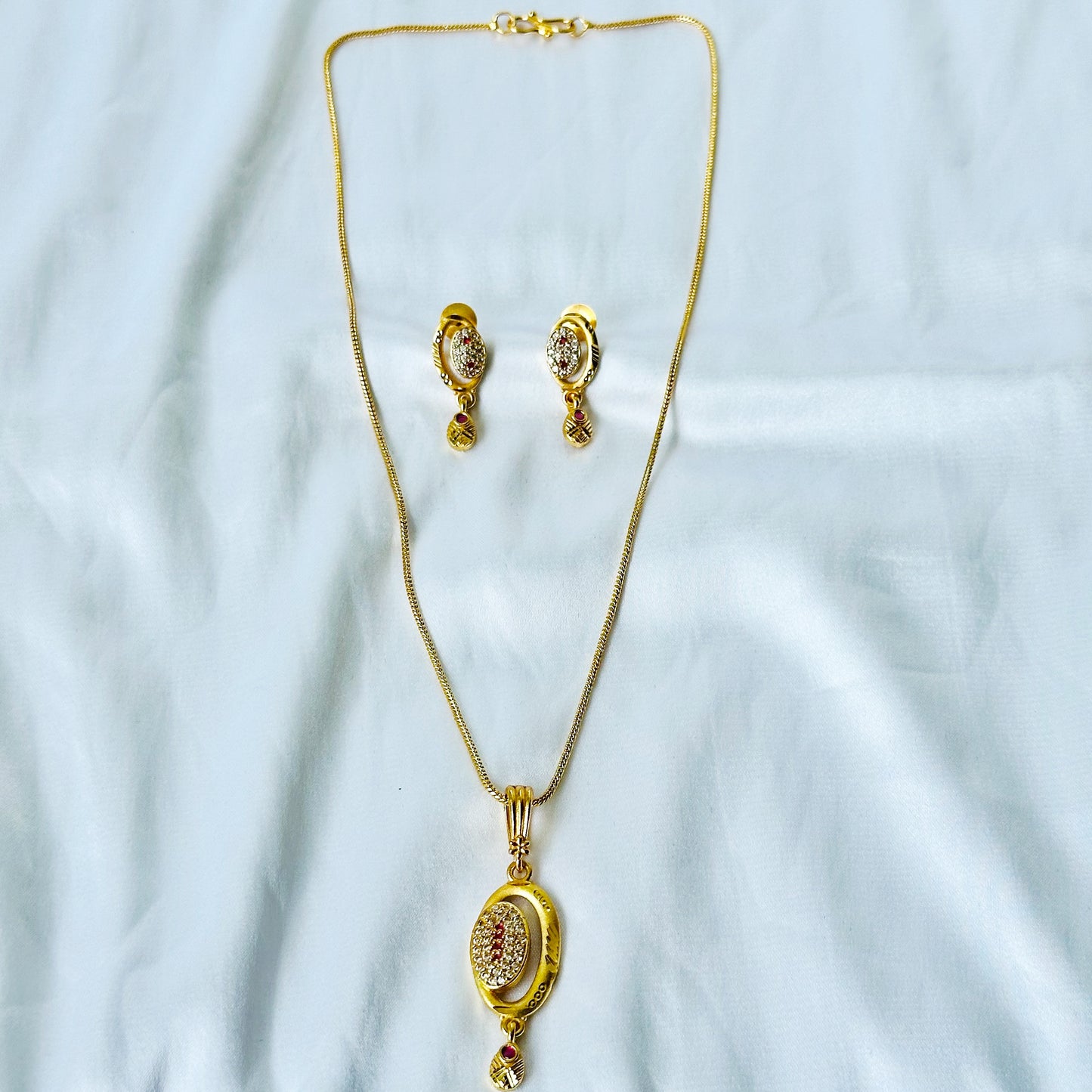 Oval Abstract Design American Diamond 1 Micron Gold Plated Pendant Set
