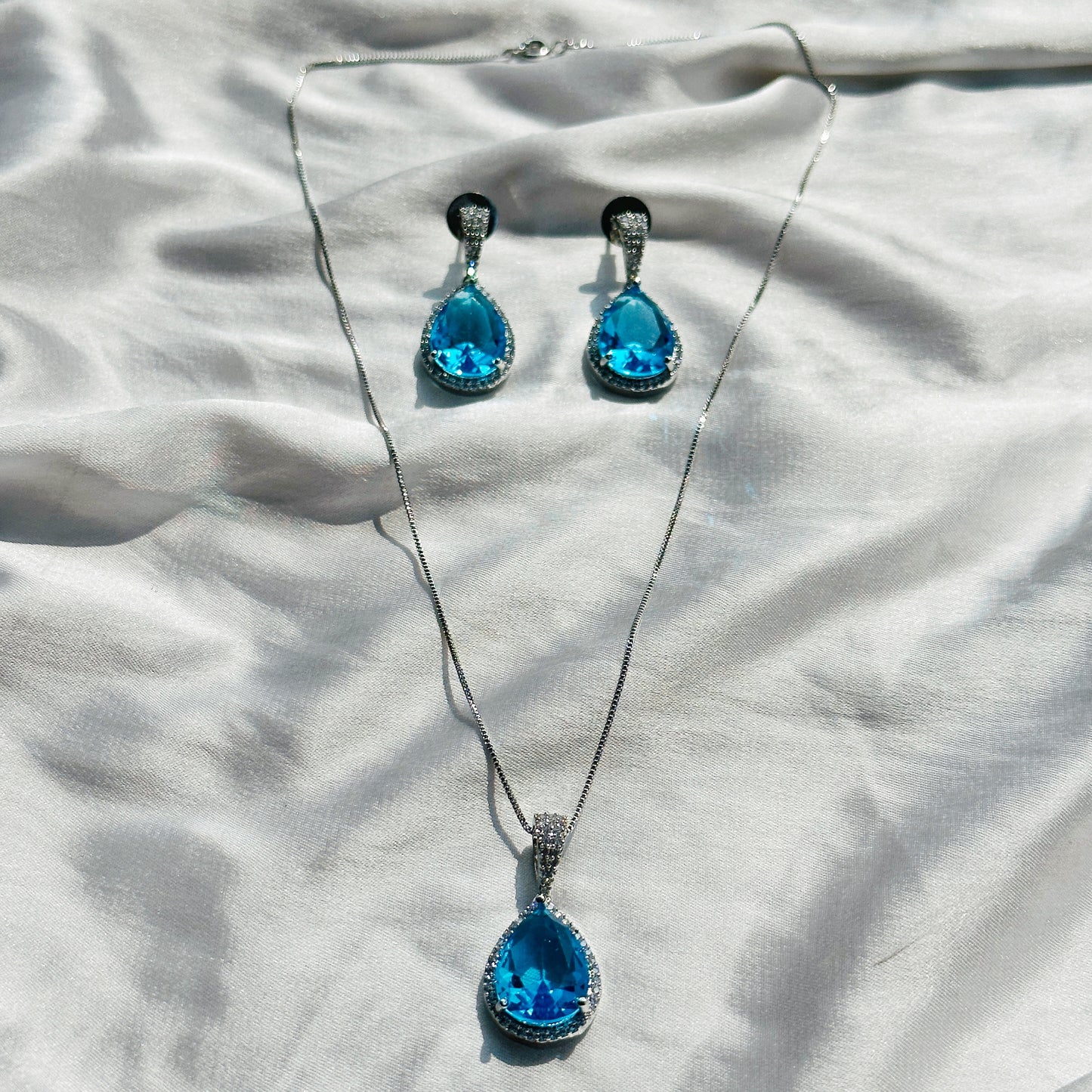 Aqua Blue Sapphire Cubic Zircon American Diamond Silver Plated Pendant Set