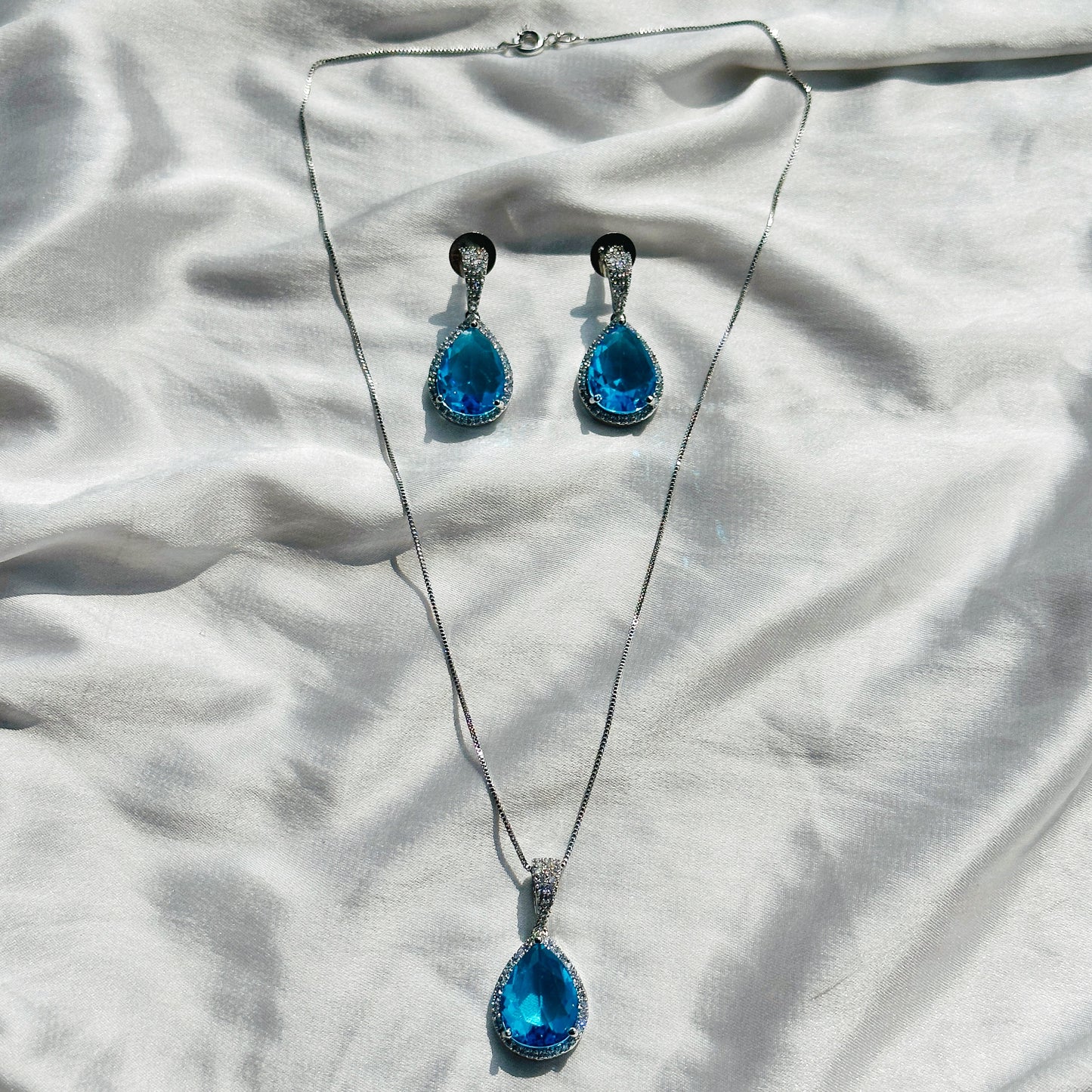 Aqua Blue Sapphire Cubic Zircon American Diamond Silver Plated Pendant Set