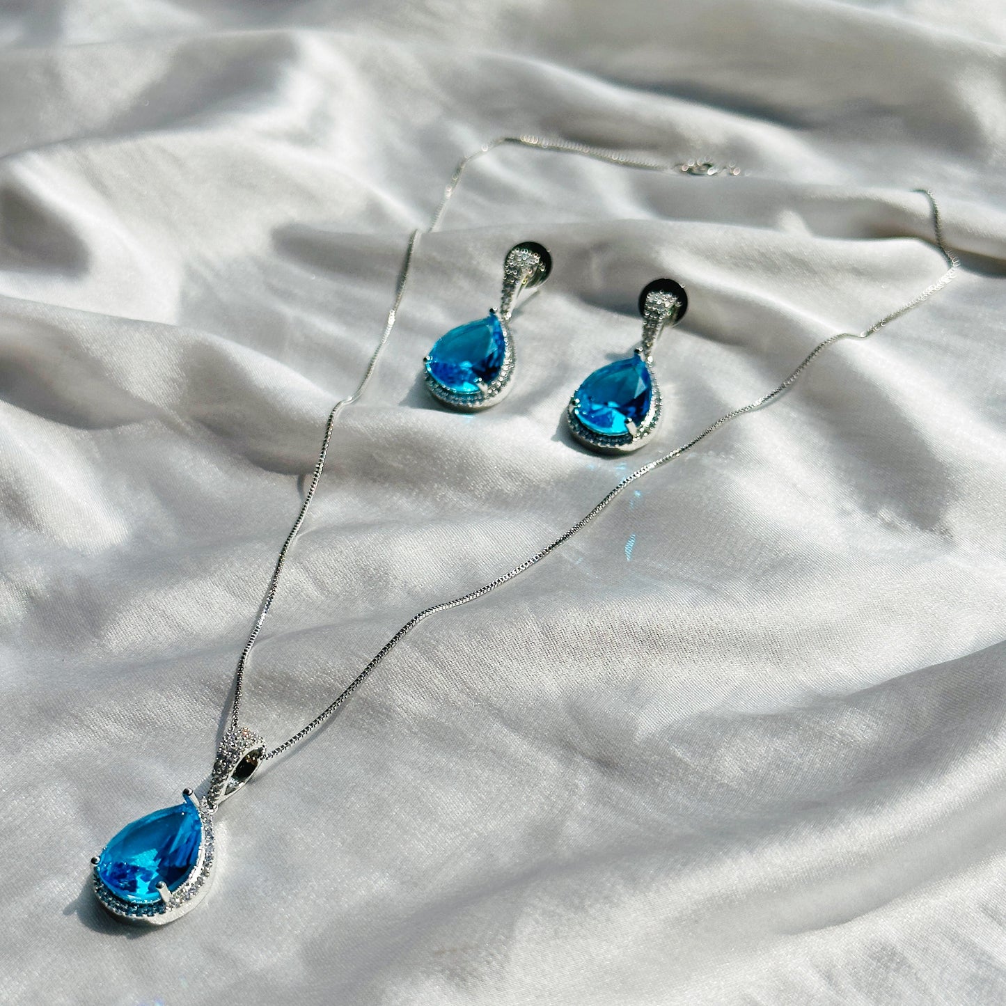 Aqua Blue Sapphire Cubic Zircon American Diamond Silver Plated Pendant Set