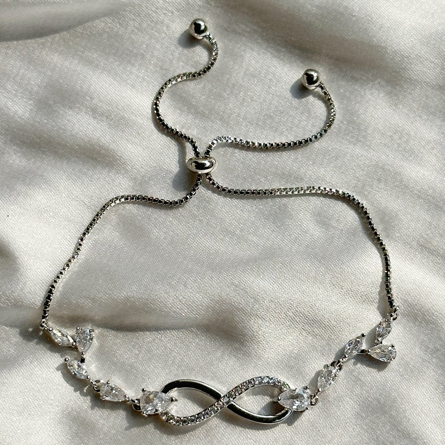 Infinity Design Cubic Zirconia American Diamond Silver Plated Adjustable Bracelet