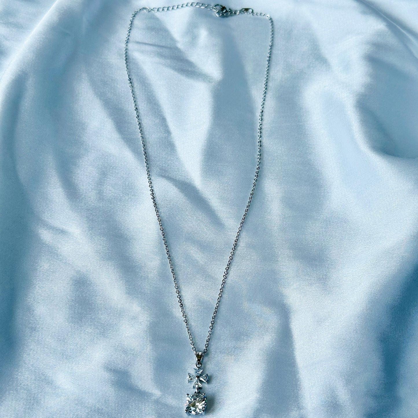 Cross Design Solitaire Cubic Zircon American Diamond Silver Plated Stainless Steel Necklace