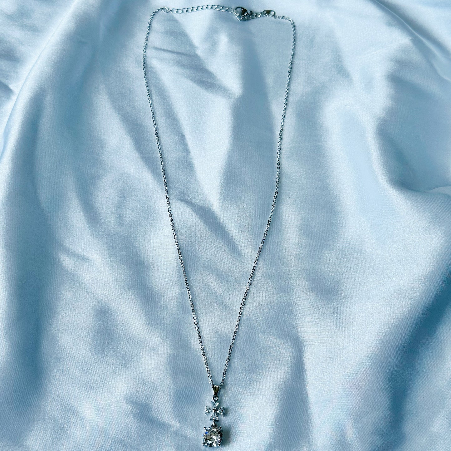 Cross Design Solitaire Cubic Zircon American Diamond Silver Plated Stainless Steel Necklace