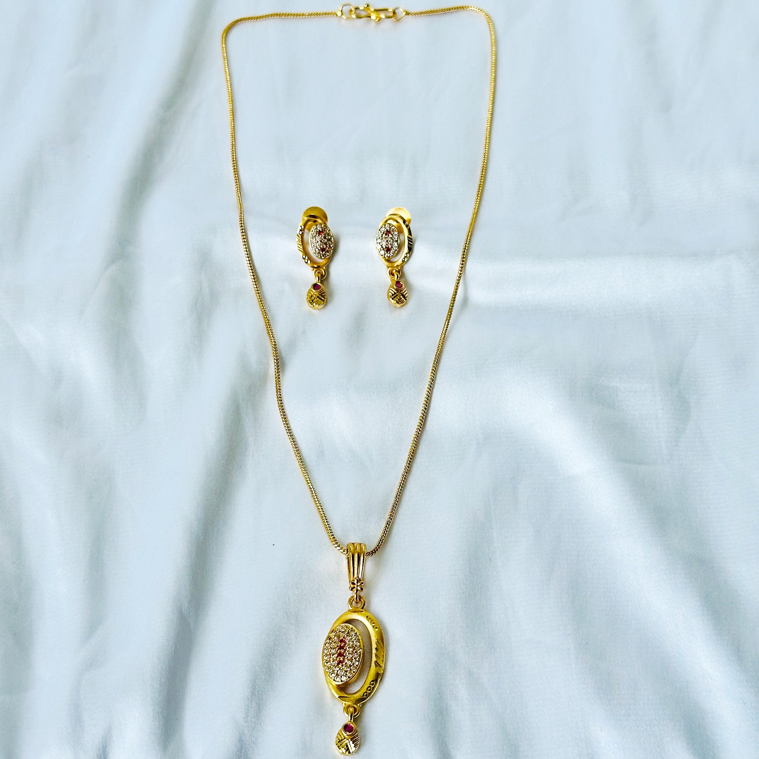 Oval Abstract Design American Diamond 1 Micron Gold Plated Pendant Set
