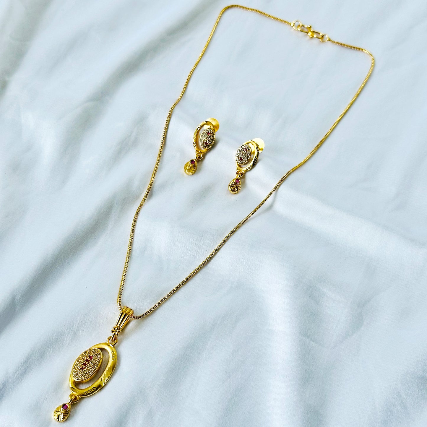 Oval Abstract Design American Diamond 1 Micron Gold Plated Pendant Set