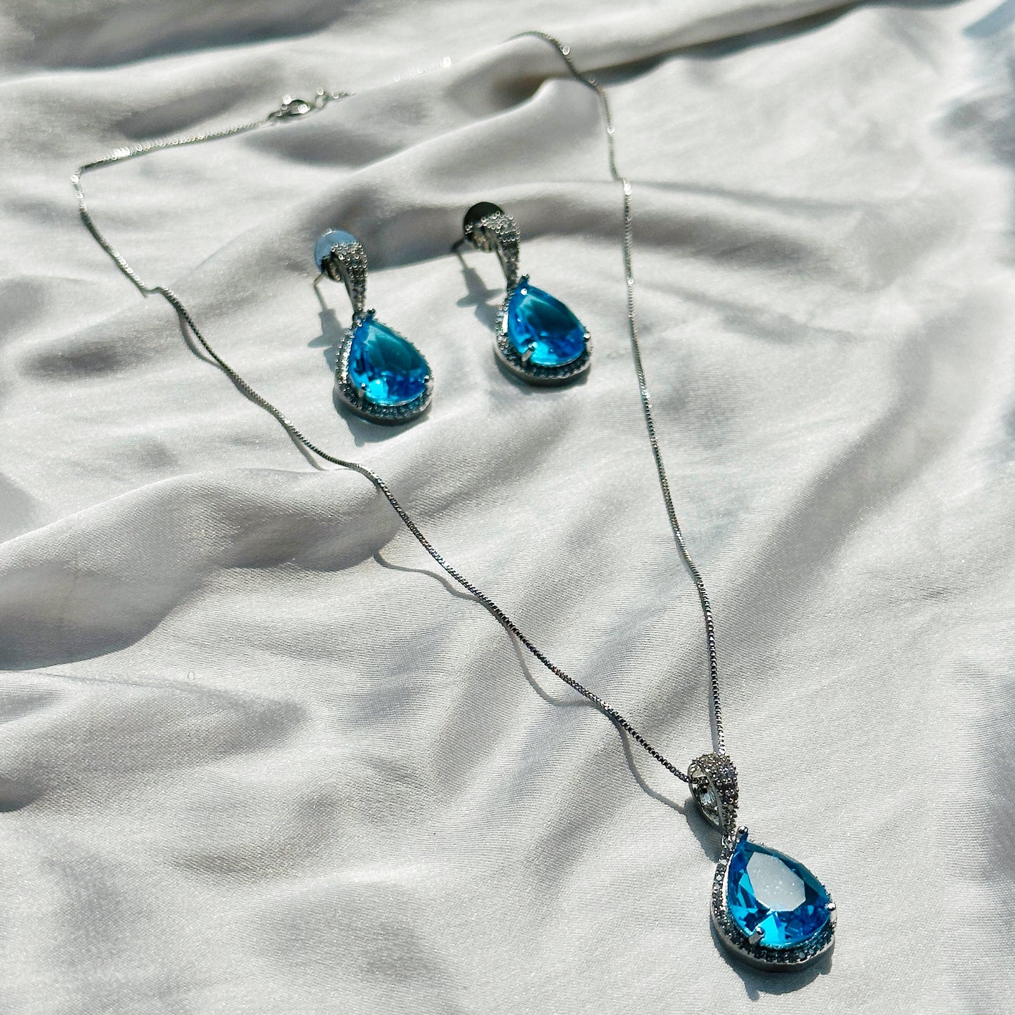 Aqua Blue Sapphire Cubic Zircon American Diamond Silver Plated Pendant Set