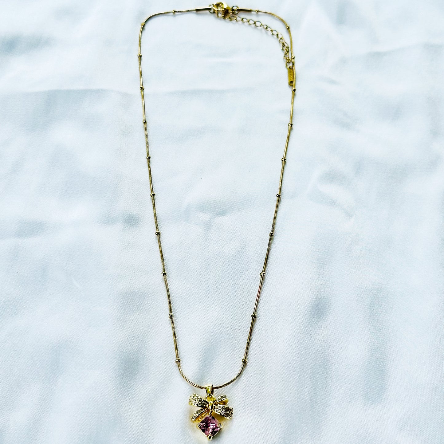 Pink Topaz Cubic Zirconia Bow Design American Diamond Gold Plated Stainless Steel Necklace