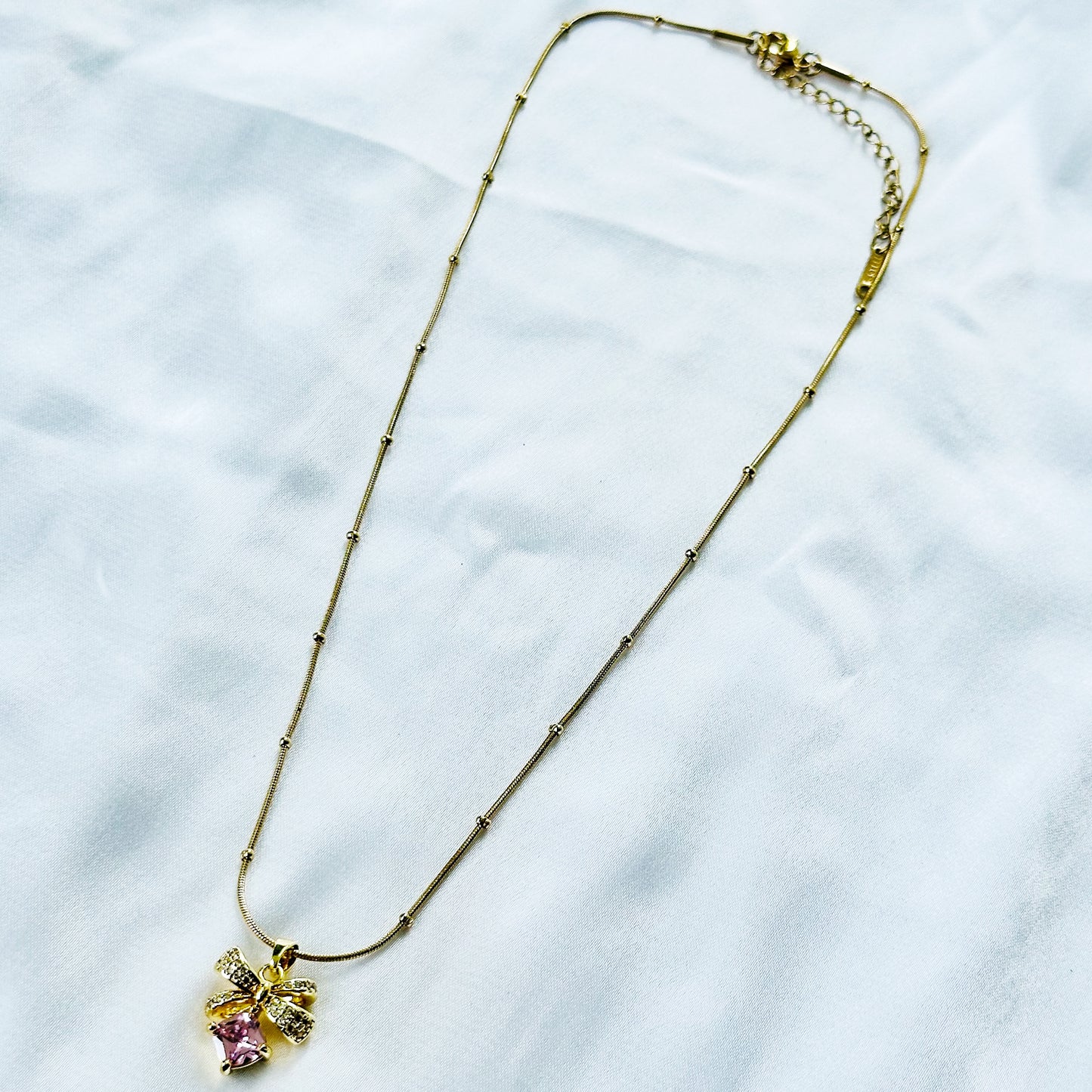 Pink Topaz Cubic Zirconia Bow Design American Diamond Gold Plated Stainless Steel Necklace