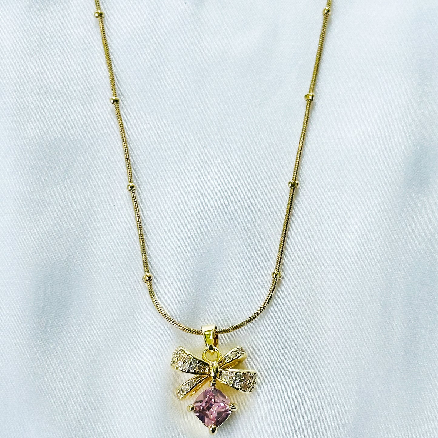 Pink Topaz Cubic Zirconia Bow Design American Diamond Gold Plated Stainless Steel Necklace