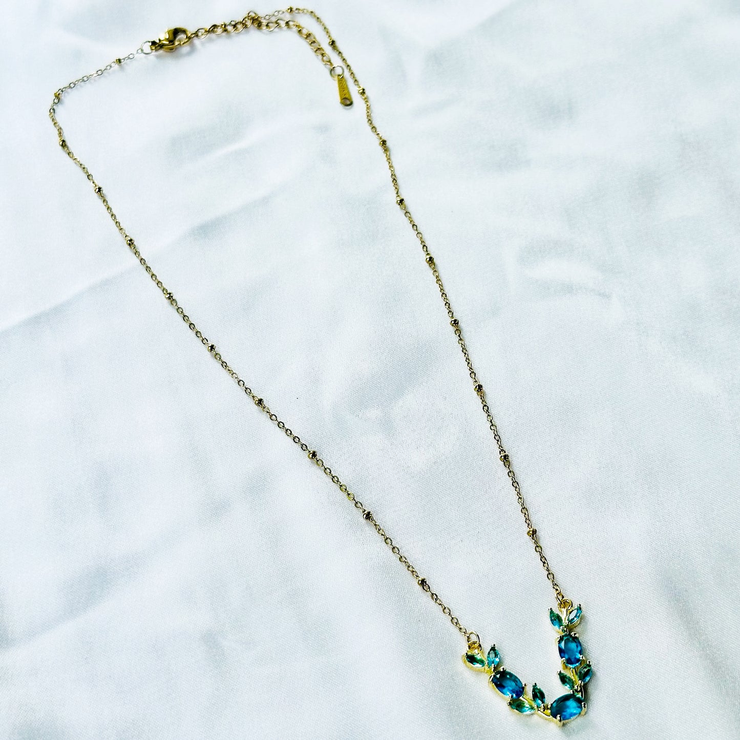 Aqua Blue Sapphire Cubic Zirconia Tulip Design American Diamond Gold Plated Stainless Steel Necklace