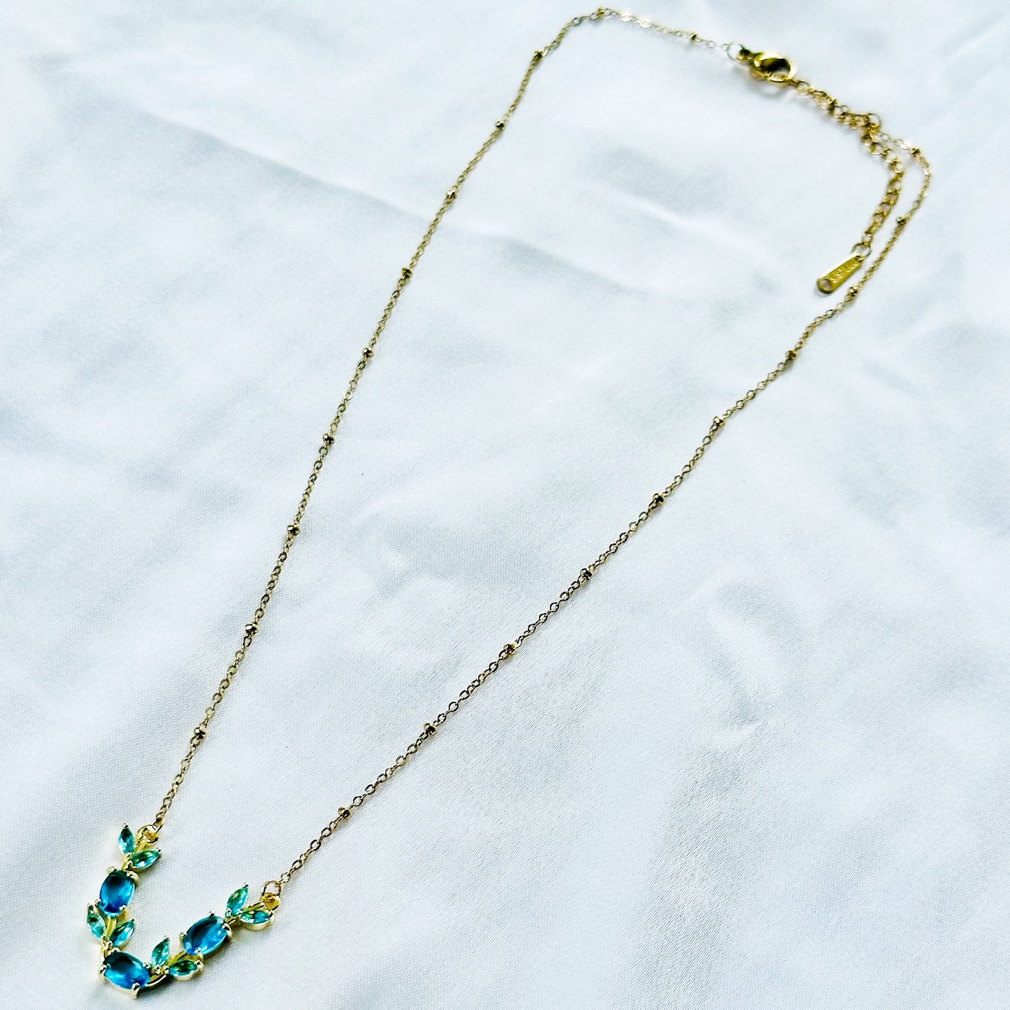 Aqua Blue Sapphire Cubic Zirconia Tulip Design American Diamond Gold Plated Stainless Steel Necklace