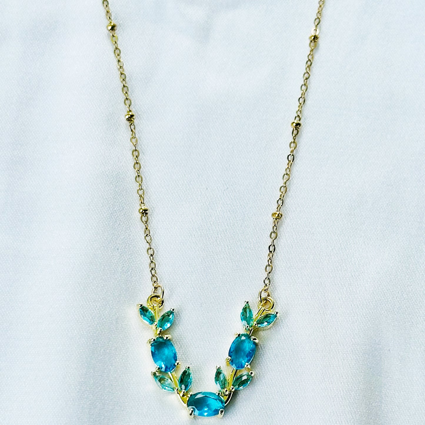 Aqua Blue Sapphire Cubic Zirconia Tulip Design American Diamond Gold Plated Stainless Steel Necklace