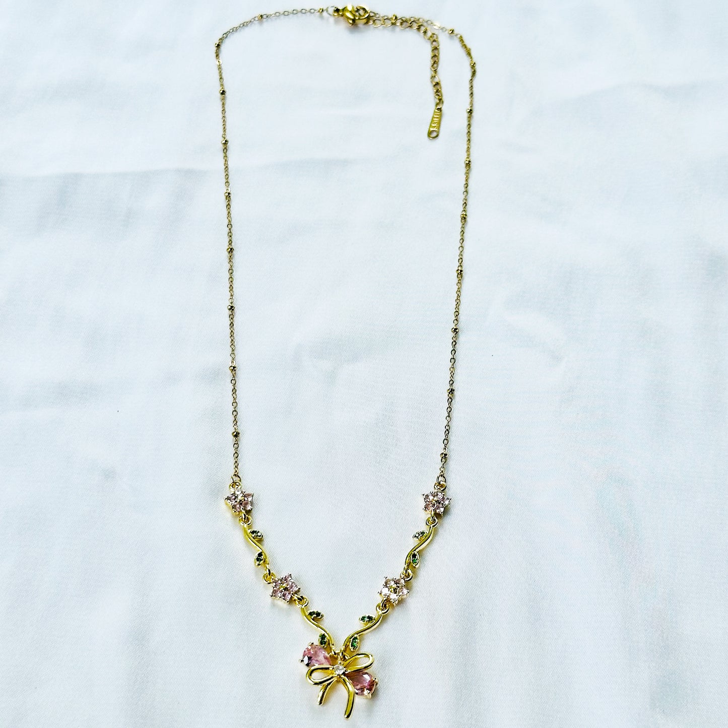 Green Emerald & Pink Topaz Cubic Zirconia Bow Design American Diamond Gold Plated Stainless Steel Necklace