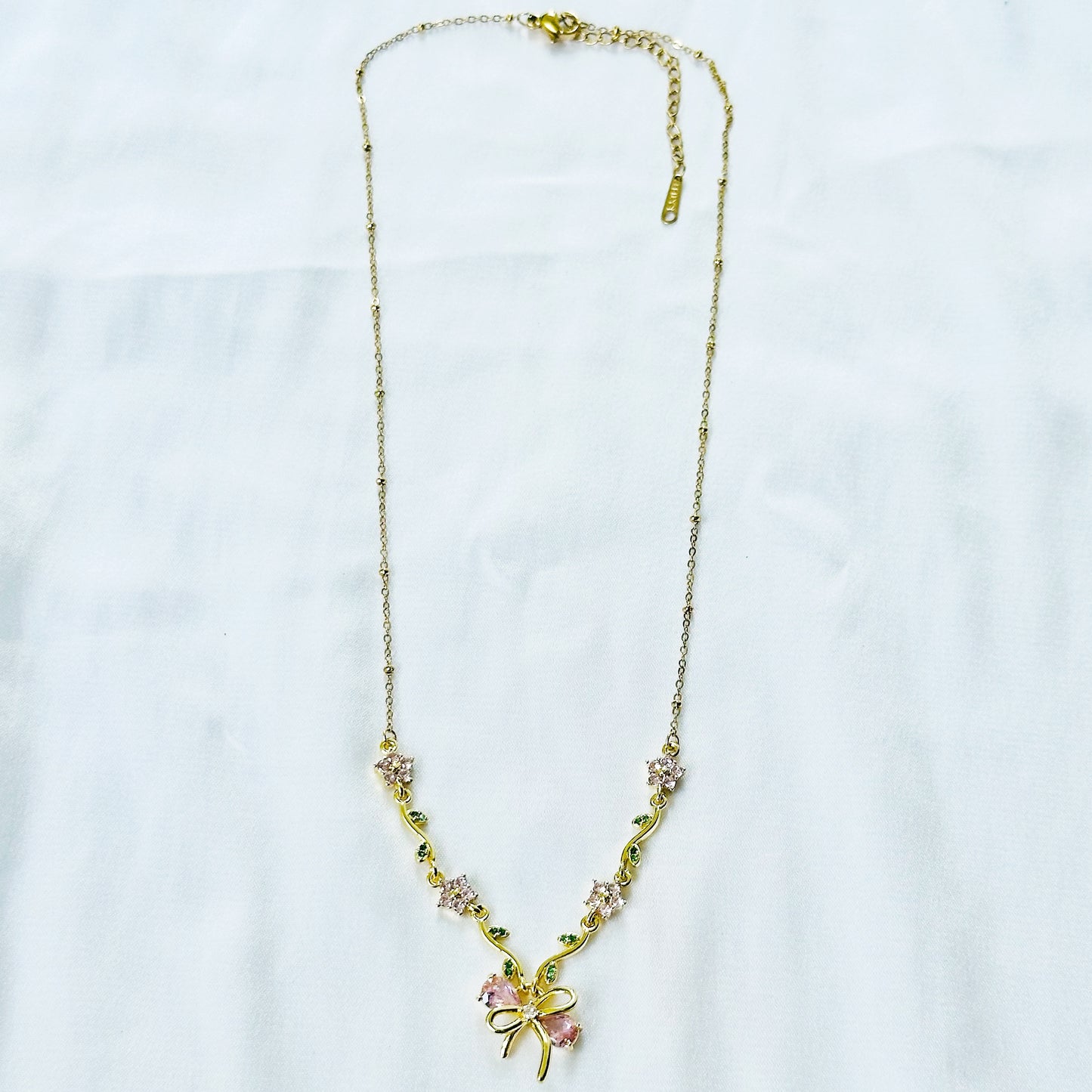Green Emerald & Pink Topaz Cubic Zirconia Bow Design American Diamond Gold Plated Stainless Steel Necklace