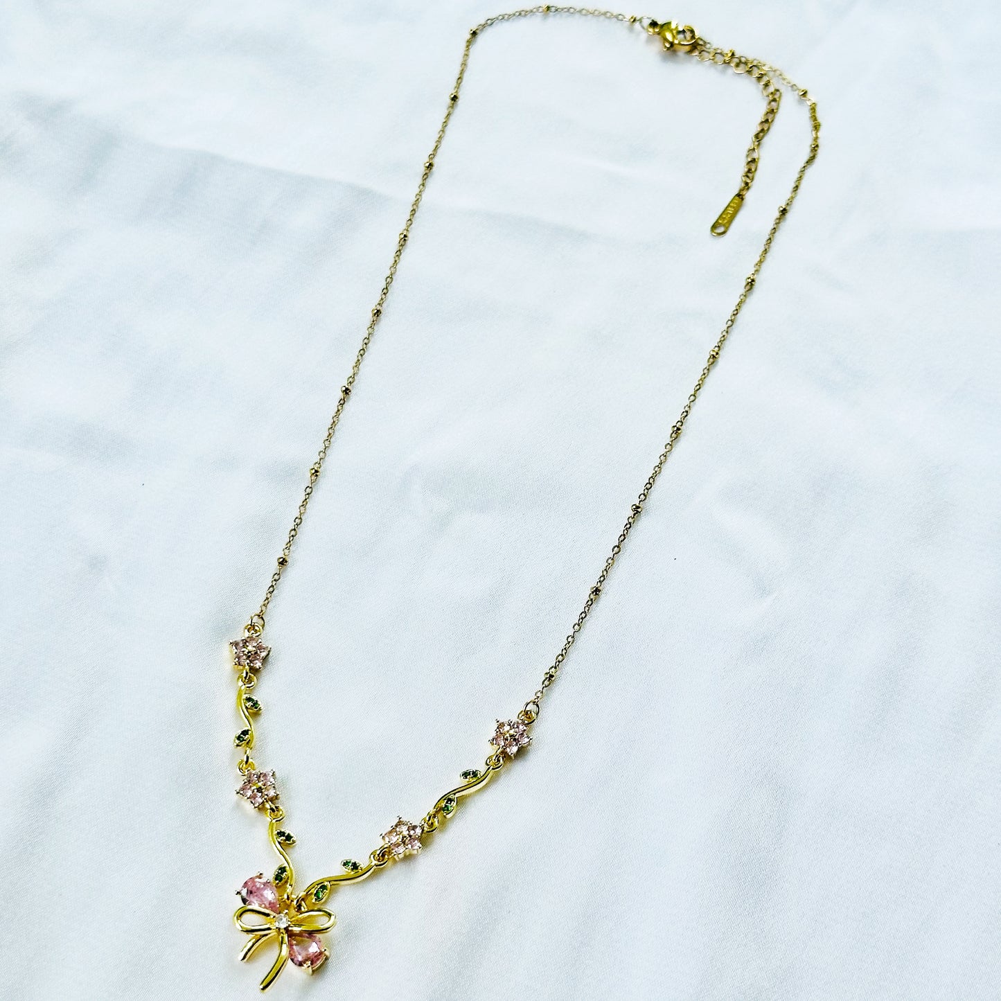 Green Emerald & Pink Topaz Cubic Zirconia Bow Design American Diamond Gold Plated Stainless Steel Necklace