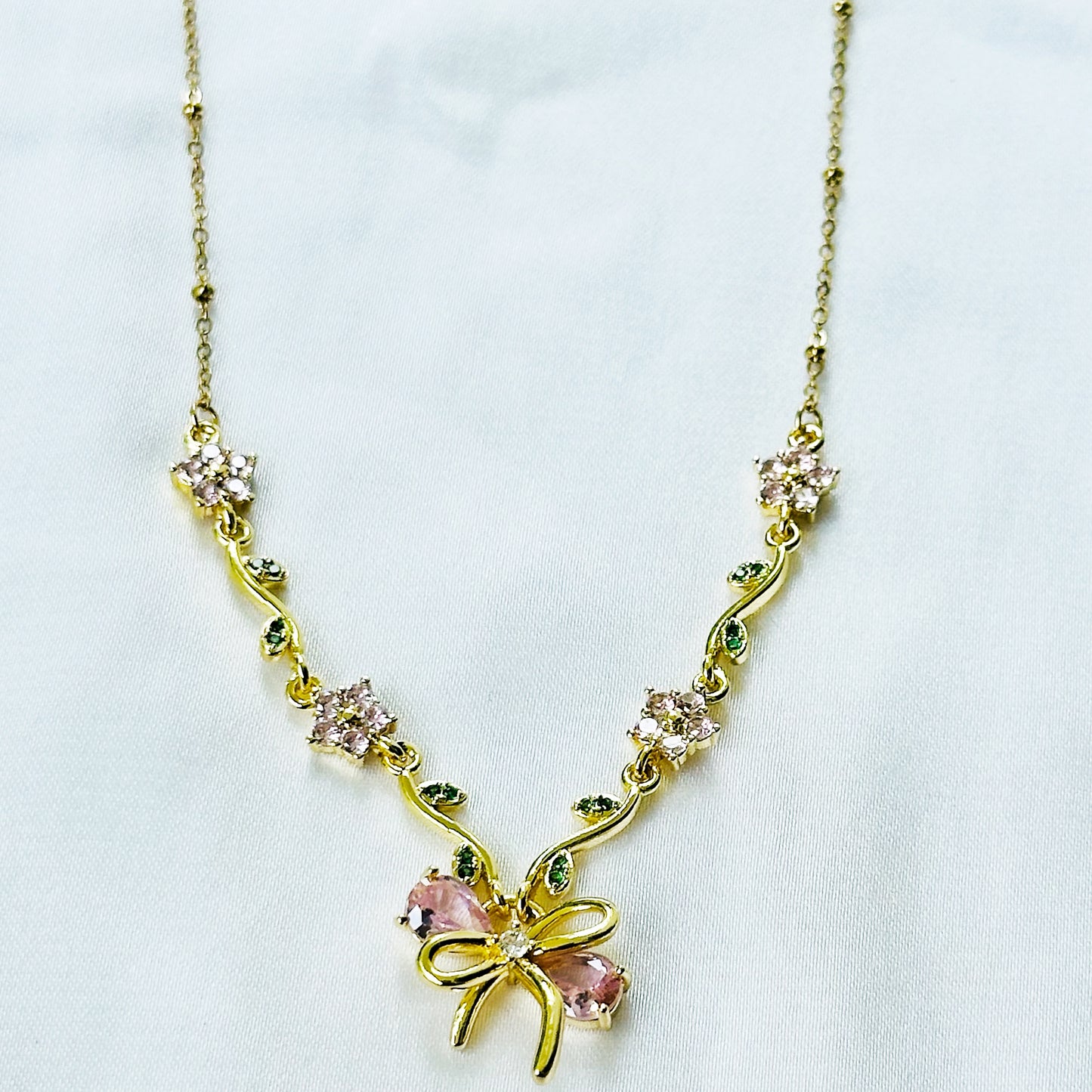 Green Emerald & Pink Topaz Cubic Zirconia Bow Design American Diamond Gold Plated Stainless Steel Necklace