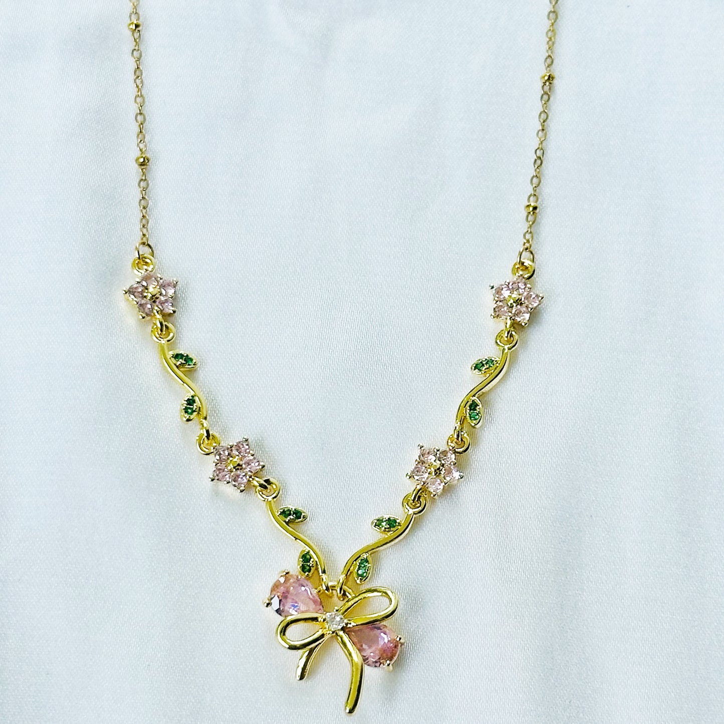 Green Emerald & Pink Topaz Cubic Zirconia Bow Design American Diamond Gold Plated Stainless Steel Necklace