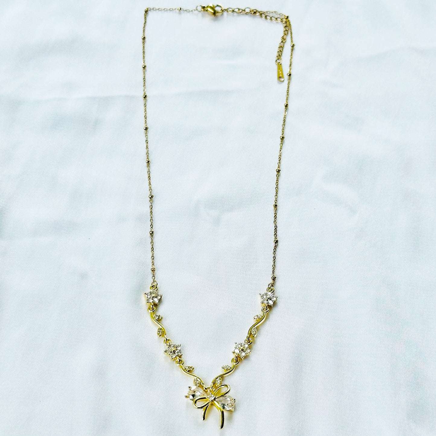 Solitaire Cubic Zirconia Bow Design American Diamond Gold Plated Stainless Steel Necklace