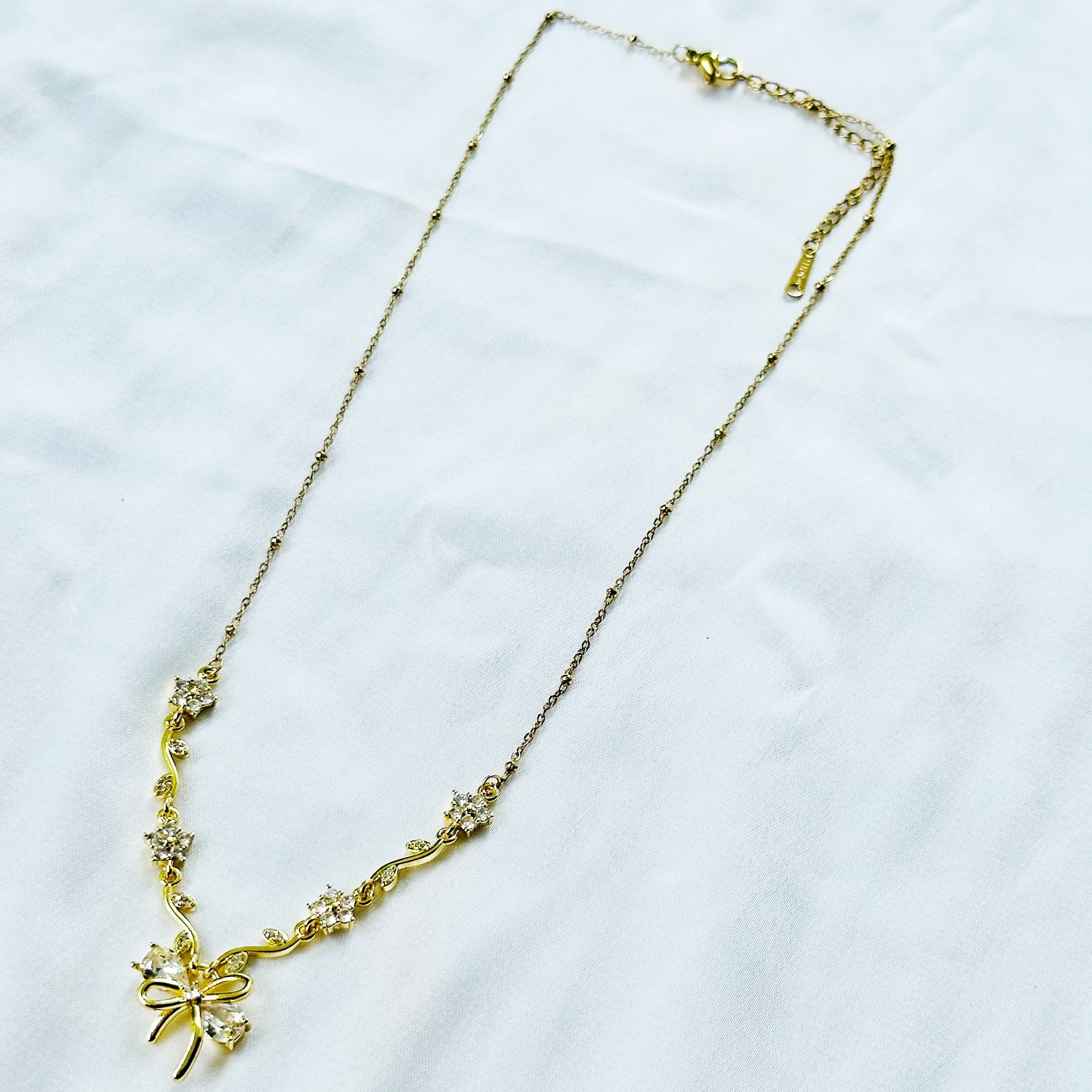 Solitaire Cubic Zirconia Bow Design American Diamond Gold Plated Stainless Steel Necklace