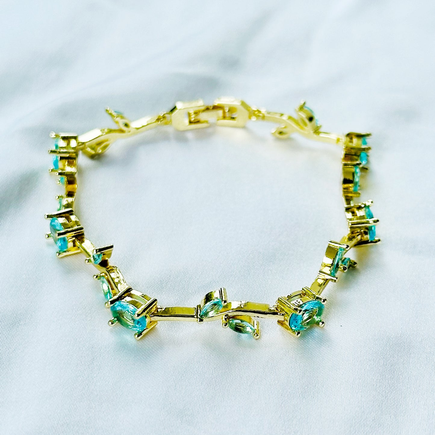Aqua Blue Sapphire Cubic Zirconia Tulip Design American Diamond Gold Plated Stainless Steel Bracelet
